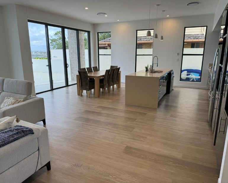 Renovated kitchen and dining area with island bench and timber floors