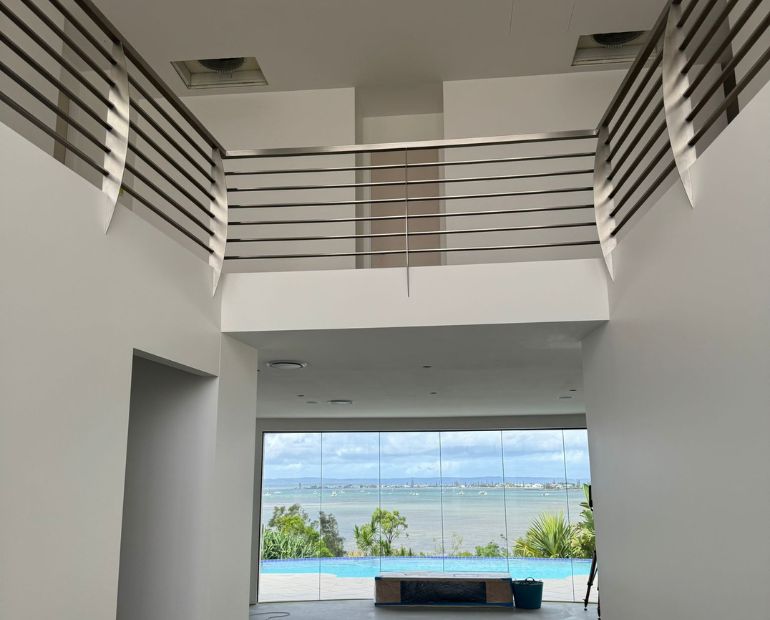 Painted double-height void overlooking the water
